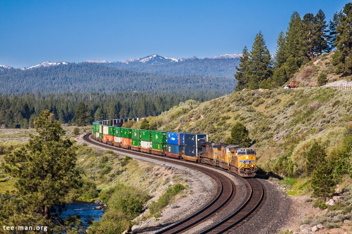 An eastbound doublestack container train rounds the bends east of Truckee. 6.6.2014