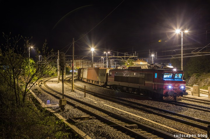 Night photo of container train to port of Koper.